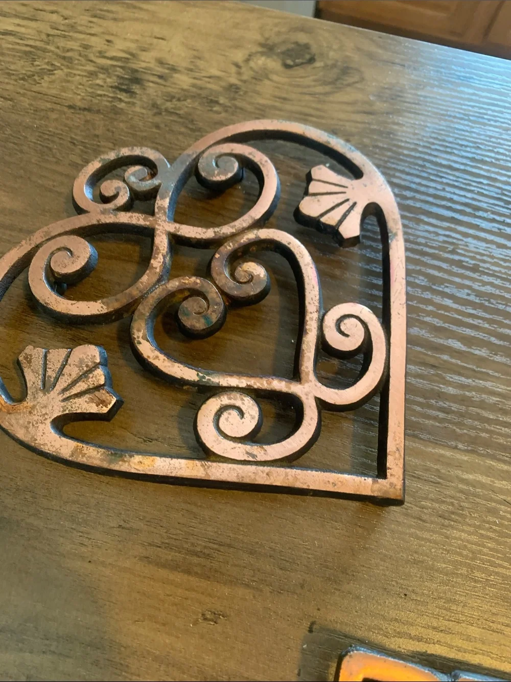 The Pampered Chef Copper-Tone Ornate Trivet Set.
